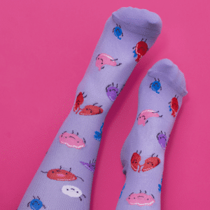 Lilac coloured compression socks with cartoon organs on them.