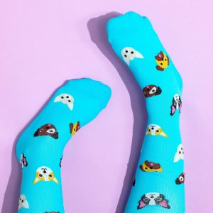 Bright blue dog compression socks on a lilac background