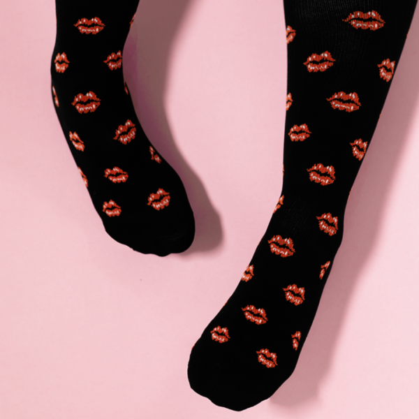 Black compression socks with red lips repeat pattern